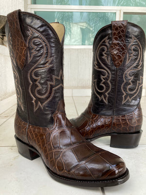 A pair of chocolate brown American alligator custom boots made using a customers own hide 