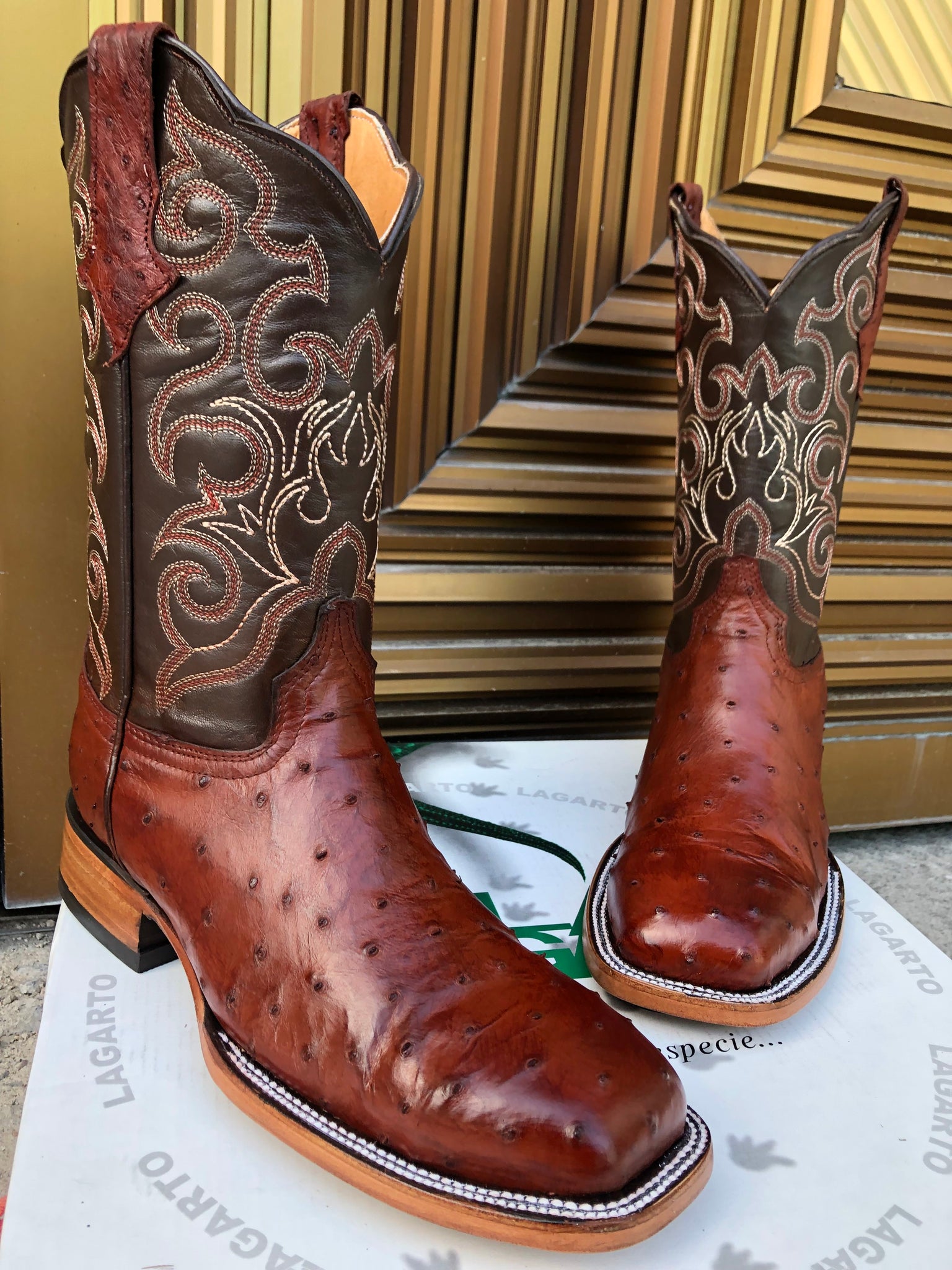 A pair of Cogñac Full Quill Ostrich Cowboy Steel Toe Work Boots with Leather Sole