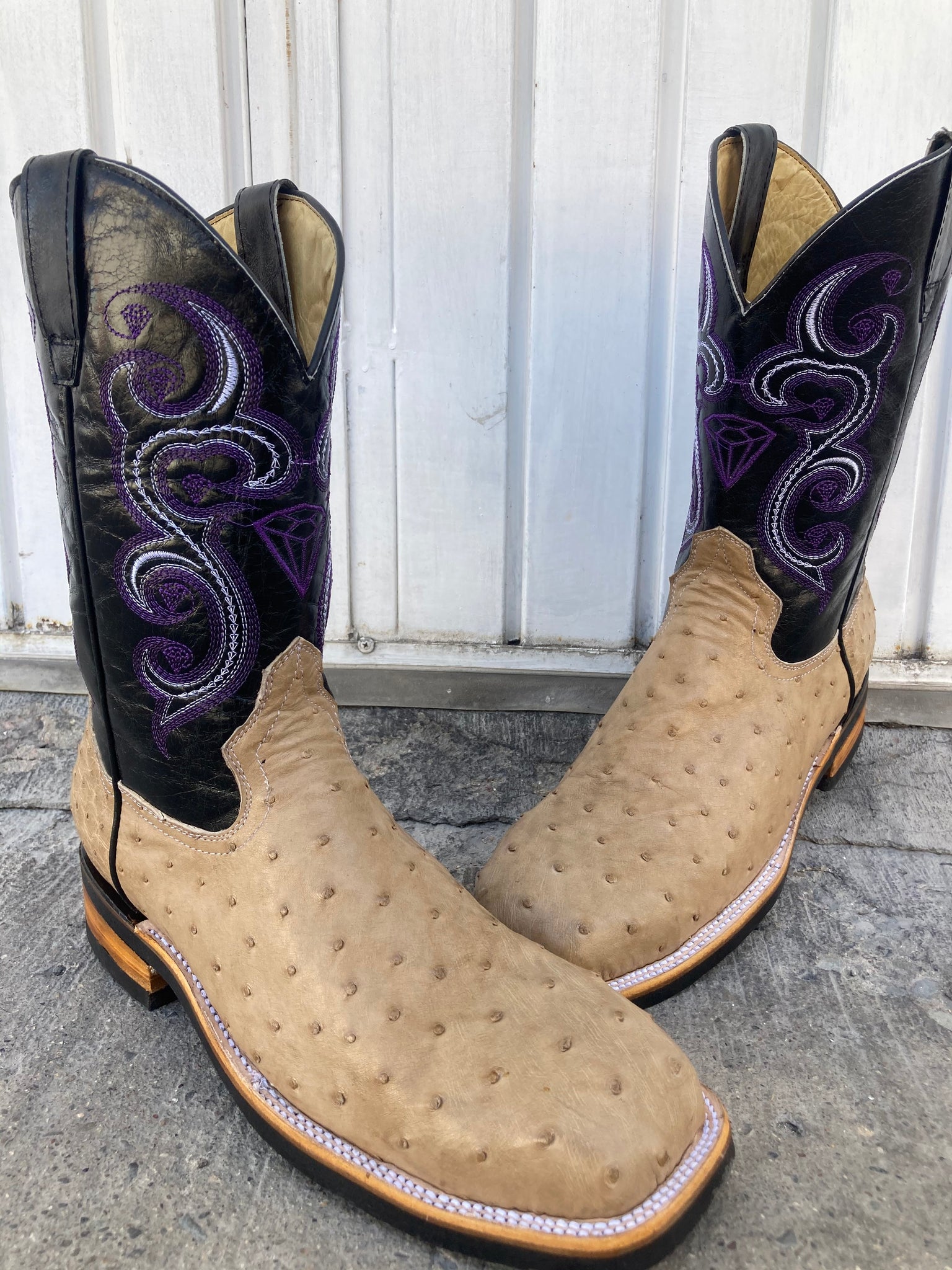 A pair of Custom Made Work Boots in  Ostrich skin  with steel toe and slip resistant soles